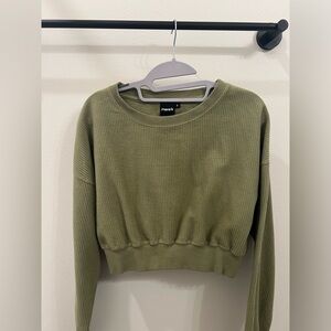 Cropped green sweater